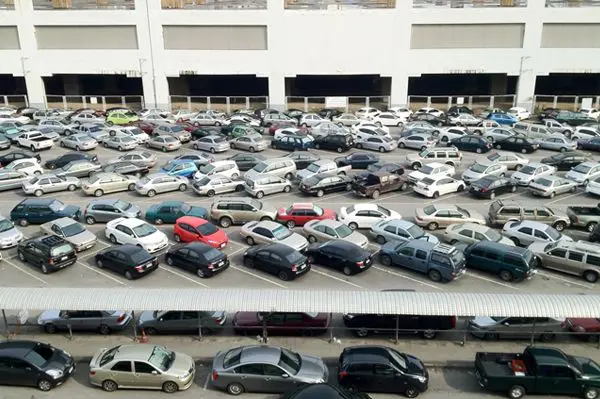 Lots of cars parked in parking lot